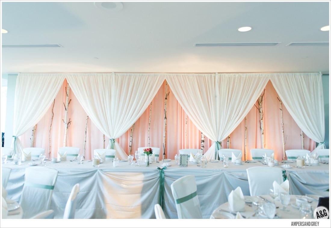 Birch tree backdrop in soft peach and ivory.