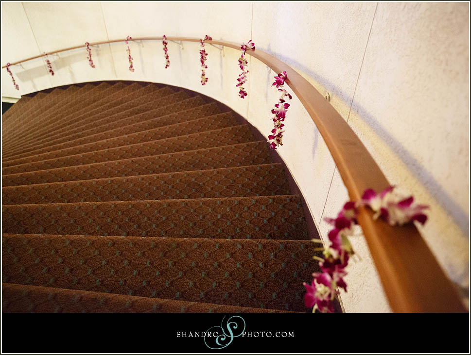 Orchids dripped over the staircase railing leading guests up to the reception room.