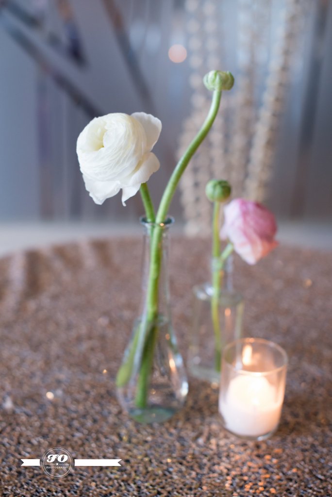 Ranunculus in glass vials.